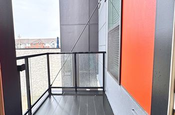 Private balcony with glass railing and view